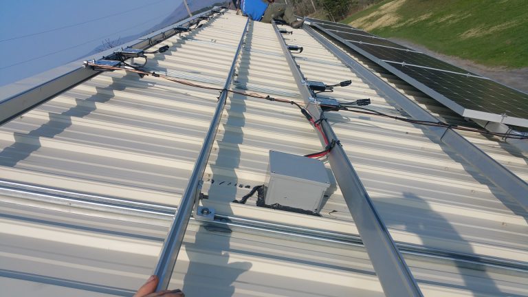 Solar racking rails on a metal roof